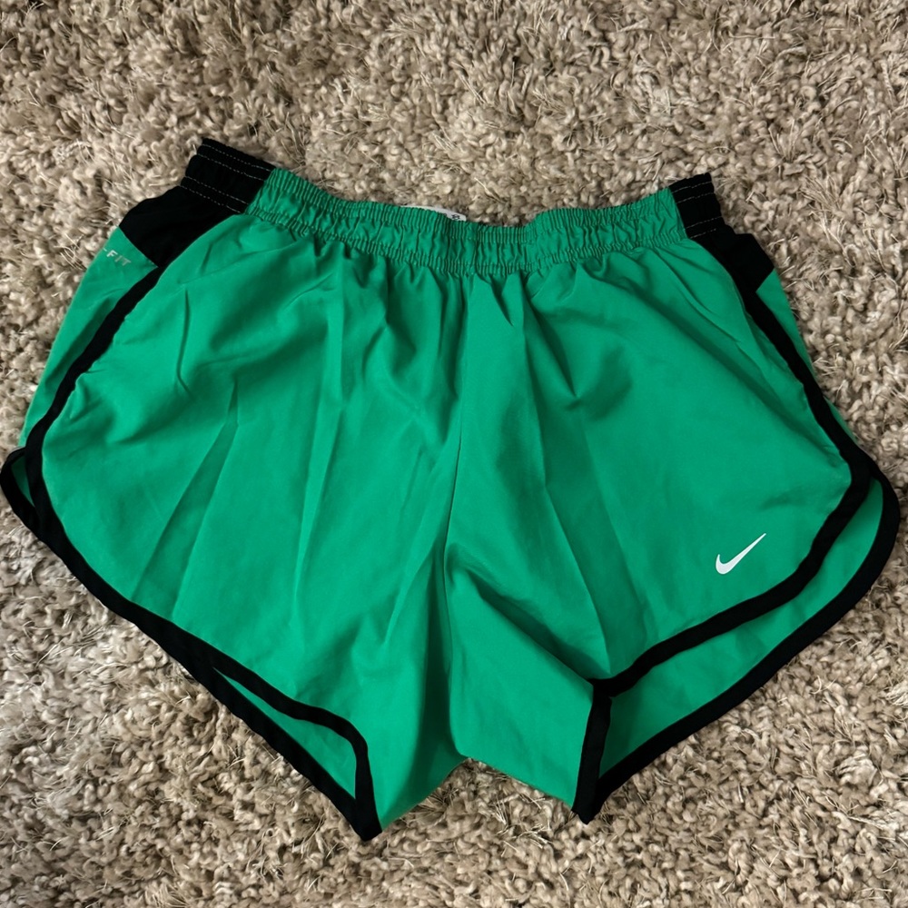 Size Small green Nike running shorts. The logo and stripe on hip are reflective.